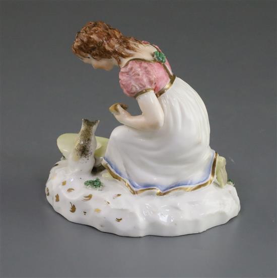 A Rockingham porcelain group of a kneeling girl playing with a kitten, c.1830, h. 10.5cm, small losses